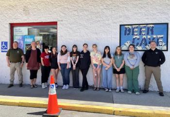 The Wiscasset High School YSUP team is joined by Officer Farrel and Officer Solorzano to place stickers on alcohol products at the Mobil Clipper Mart. Courtesy photo YSUP team