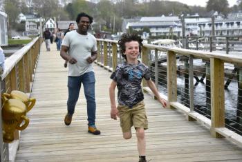A young attendee races to the finish line during Bigelow Laboratory's 9th annual Fun Run & Walk for Colorectal Cancer Awareness. ISABELLE CURTIS/Boothbay Register