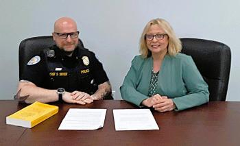 Boothbay Harbor Police Chief Doug Snyder and State Rep. Holly Stover review their bill.  JANE CARPENTER/Boothbay Register