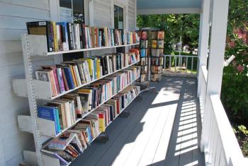 The locally famous porch at the Used Bookstore on McKown Street offers a great variety of books in exchange for a small donation. File photo
