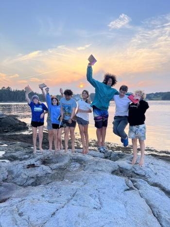Jumping for joy at sunset. Courtesy of Hearty Roots