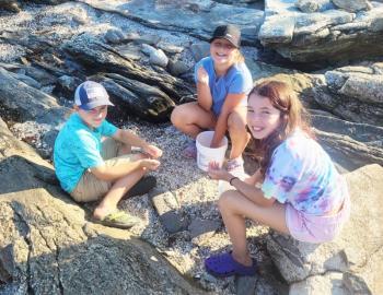 Checking out their tidepool finds on Burnt Island. Courtesy of Elaine Jones