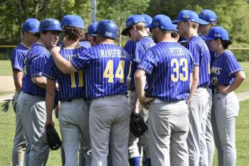 Coach Ed Crocker, left, has a word with his team before their June 3 game. FRITZ FREUDENBERGER/Boothbay Register