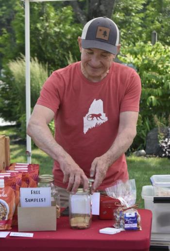 Matt Burke, owner of Sweet Monkey Business, hands out free samples of his short bread cookies. ISABELLE CURTIS/Boothbay Register