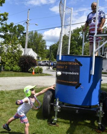 Charlie Stanley, with the Freedom Riders Association, went swimming frequently in the dunk tank. FRITZ FREUDENBERGER/BOOTHBAY REGISTER