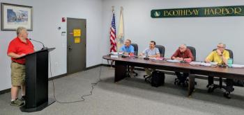 Chris Higgins, left, represents the Boothbay Harbor Sewer District at the Aug. 13 planning board meeting. FRITZ FREUDENBERGER/Boothbay Register