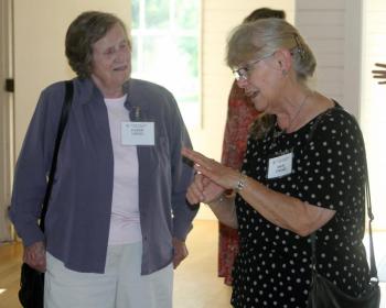 Two volunteers for the Register's digitization campaign chat. STEVE EDWARDS/Boothbay Register