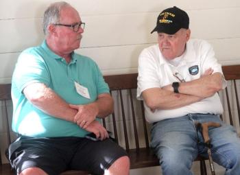 Boothbay Register Editor Kevin Burnham talks with columnist Joe Gelarden. STEVE EDWARDS/Boothbay Register