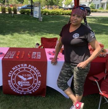 Cara Malone, founder of 9/11 Never Forgets, was one of several vendors discussing her non-profit work which benefits veterans and firefighters. BILL PEARSON/Boothbay Register Lady Vet