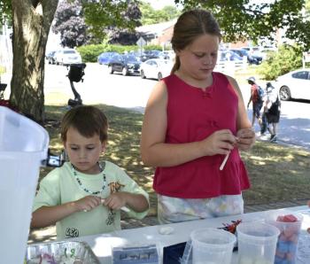 Kids craft their own plankton for Bigelow's race activity. ISABELLE CURTIS/Boothbay Register