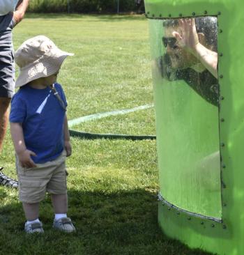 Hunter Arsenault surprises his son, Calder, from inside the dunk tank. FRITZ FREUDENBERGER/Boothbay Register