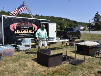Tom Caron mans the cooking stations. FRITZ FREUDENBERGER/Boothbay Register