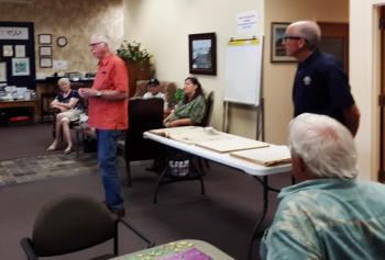 Speaking at the Community Center, Aug. 14, Merritt Blakeslee (standing, left) and Larry Brown (standing, right) ask for volunteers to scan historic Boothbay Register issues. JANE CARPENTER/Boothbay Register 