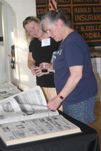 Attendees browse the Boothbay Register archives on display. STEVE EDWARDS/Boothbay Register