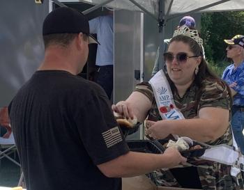 State American Legion Queen Kate Cunningham serves food at the 2025 Boothbay V.E.T.S. barbecue Aug. 2. BILL PEARSON/Boothbay Register serving queen