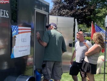 People tour the temporary shelters built by Boothbay V.E.T.S during the non-profit group's annual barbecue fundraiser. BILL PEARSON/Boothbay Register trailer snoops