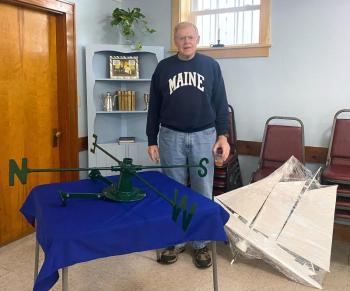 Wayne Stanley worked on restoring the church's Schooner Bowdoin weathervane. LISA KRISTOFF/Boothbay Register