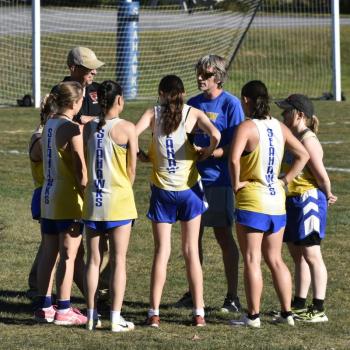 Boothbay coach Nick Scott, center, with the girls team before their race. FRITZ FREUDENBERGER/Boothbay Register