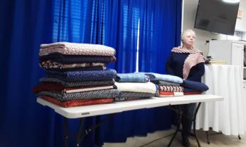 Quilts of Appreciation creator Pat Johnston with quilts to be presented at Sept. 20 event. JANE CARPENTER/Boothbay Register 