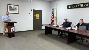 Boothbay Harbor Police Chief Doug Snyder, standing, gives the annual town parking report to the selectboard Oct. 27. FRITZ FREUDENBERGER/Boothbay Register