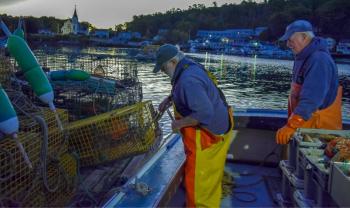 Clive Farrin and Sherman Stubbert prepare their traps first thing in the morning. FRITZ FREUDENBERGER/Boothbay Register
