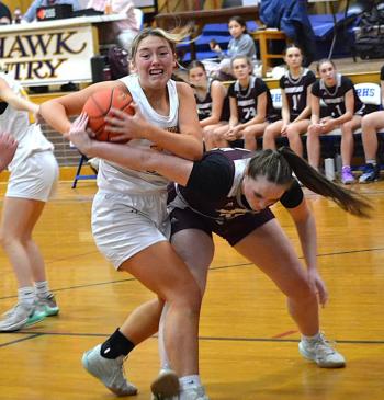 Seahawk center Tatum French takes the ball away from a Monmouth player during the second half of Wednesday's game at BRHS. French led the Seahawks with 25 points but the Seahawks lost, 47-36. KEVIN BURNHAM/Boothbay Register 