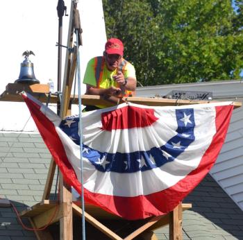 Southport Fire Chief Gerry Gamage as the auctioneer. BILL PEARSON/Boothbay Register 