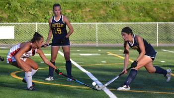 Boothbay's Zuri Smith battles a Lisbon defender as sister Moriah is nearby waiting to assist. KEVIN BURNHAM/Boothbay Register