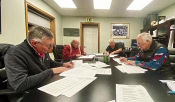 Trustees Russell Hoffman, James Stormont and Deryl Kipp approve the sewer district's budget and rates during a Dec. 4 public hearing. ISABELLE CURTIS/Boothbay Register