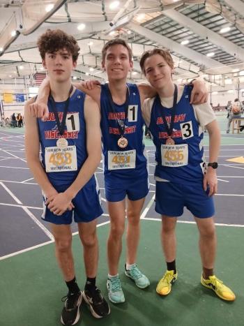 From left, Ross Gaffney, AJ Crocker, and Nathan Percival with their medals from the University of Southern Maine New Year’s Invitational. Courtesy of Nick Scott