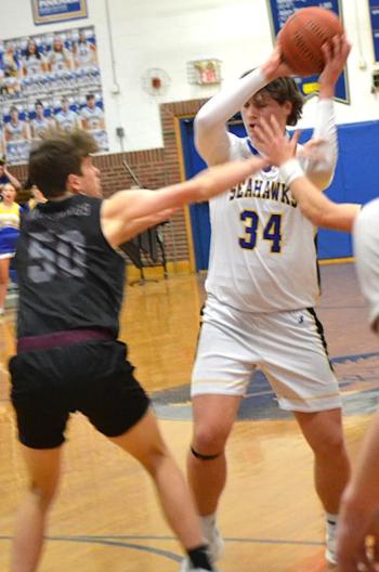Aiden Locke looks inside to find an open teammate. KEVIN BURNHAM/Boothbay Register