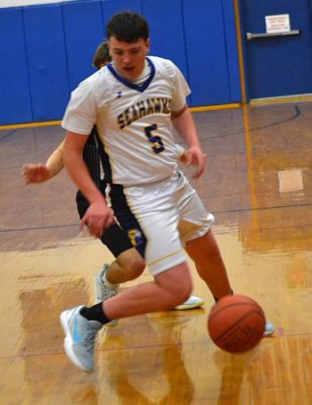 Les White uses a reverse dribble to escape a defender. KEVIN BURNHAM/Boothbay Register
