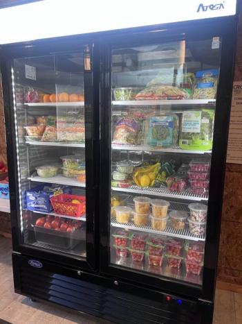 Thanks to a gift from the Mildred H. McEvoy Foundation, the Community Fridge got a new glass door refrigerator. Courtesy of Holly Stover. 