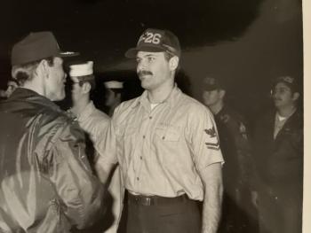 Andy Benedict listening to a higher up in the Navy. Courtesy photo