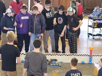 Team Popklop (from center to right, Zander Blake, Mathew Scarborough and Jayden Orne) discuss strategy. Courtesy of Chris Liberti