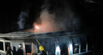 Firefighters work at containing a fire at 2 Maddocks Road in Southport on Monday, Feb. 16. Courtesy of Mark Sullivan