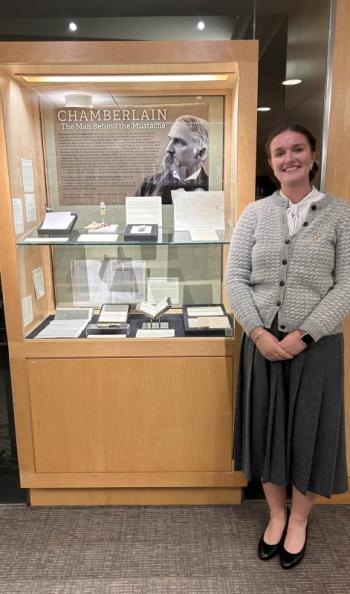 Campbell with the “Chamberlain: The Man Behind the Moustache" exhibition. Courtesy of Grace Campbell.