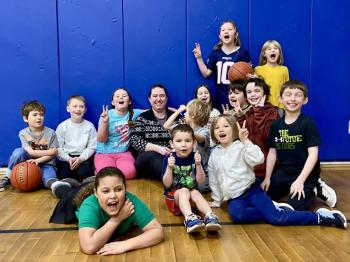 Lindsey Senecal, center, the Y’s Fit Kids Vacation Camp program director with some of the kids participating in the program during February school break. Courtesy of Allyson Goodwin