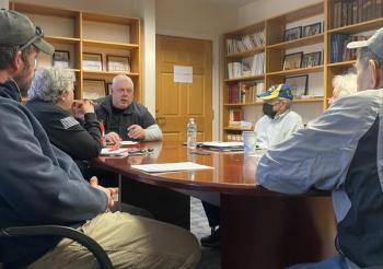 Robert Malizia suggests alternative options for a sign replacement at Evergreen Cemetery during a March 25 trustee meeting. ISABELLE CURTIS/Boothbay Register