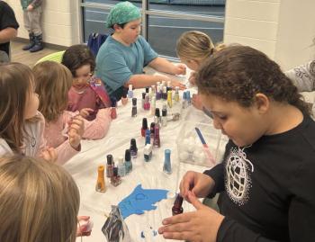 Dolphin teammates paint each other's nails before the big meet. Courtesy of Emily LeGree 