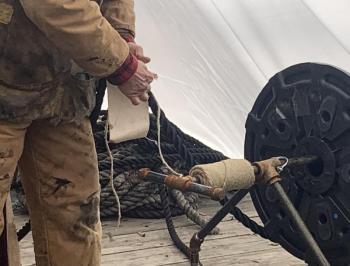 Hernández-Juviel shows how to worm, parcel and serve a line. ISABELLE CURTIS/Boothbay Register