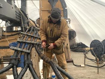 Jose Hernández-Juviel uses a marlinspike on refurbished rigging during a March 19 demonstration. ISABELLE CURTIS/Boothbay Register