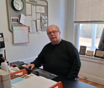 Editor Kevin Burnham at his desk at the Boothbay Register. Connie Hartley photo
