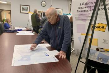 A resident points out areas affected by climate change. ISABELLE CURTIS/Boothbay Register