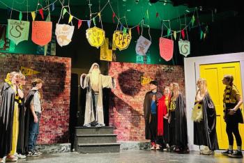CTL’s 5th through 8th grade students perform a scene from the play, “Puffs,” to a packed house. Courtesy of CTL