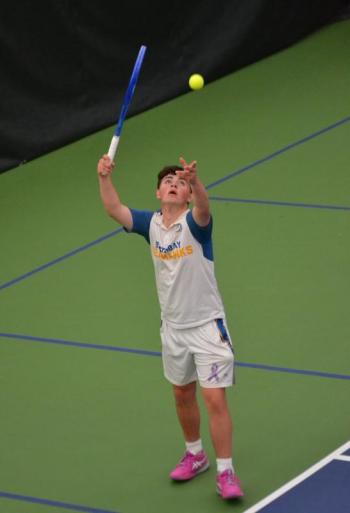 Alex Ross, no. 1 singles, serves against his Madison opponent. KEVIN BURNHAM/Boothbay Register