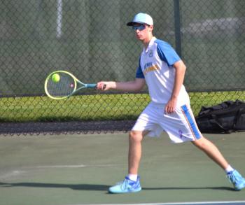 Cole Hyson catches up to the ball during his third singles match against NYA on Tuesday, May 19. KEVIN BURNHAM/Boothbay Register