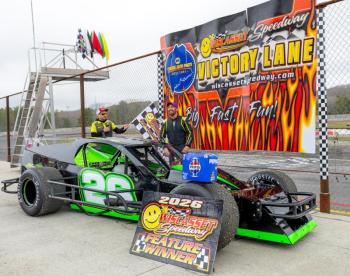 Ryan Neal climbs out of his car after earning his first career feature victory at Wiscasset Speedway. Jasen Dickey photo