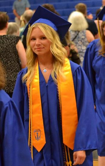 Madeleine Andreasen marches to the stage. KEVIN BURNHAM/Boothbay Register