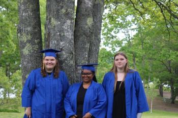 Nevaeh Morin, left, Camla Dunbar, and Allyson Warren celebrated their graduation from Boothbay-Wiscasset Regional Adult Education at Barrett Park on June 6. Anina Halter, not pictured, also graduated. Courtesy photo